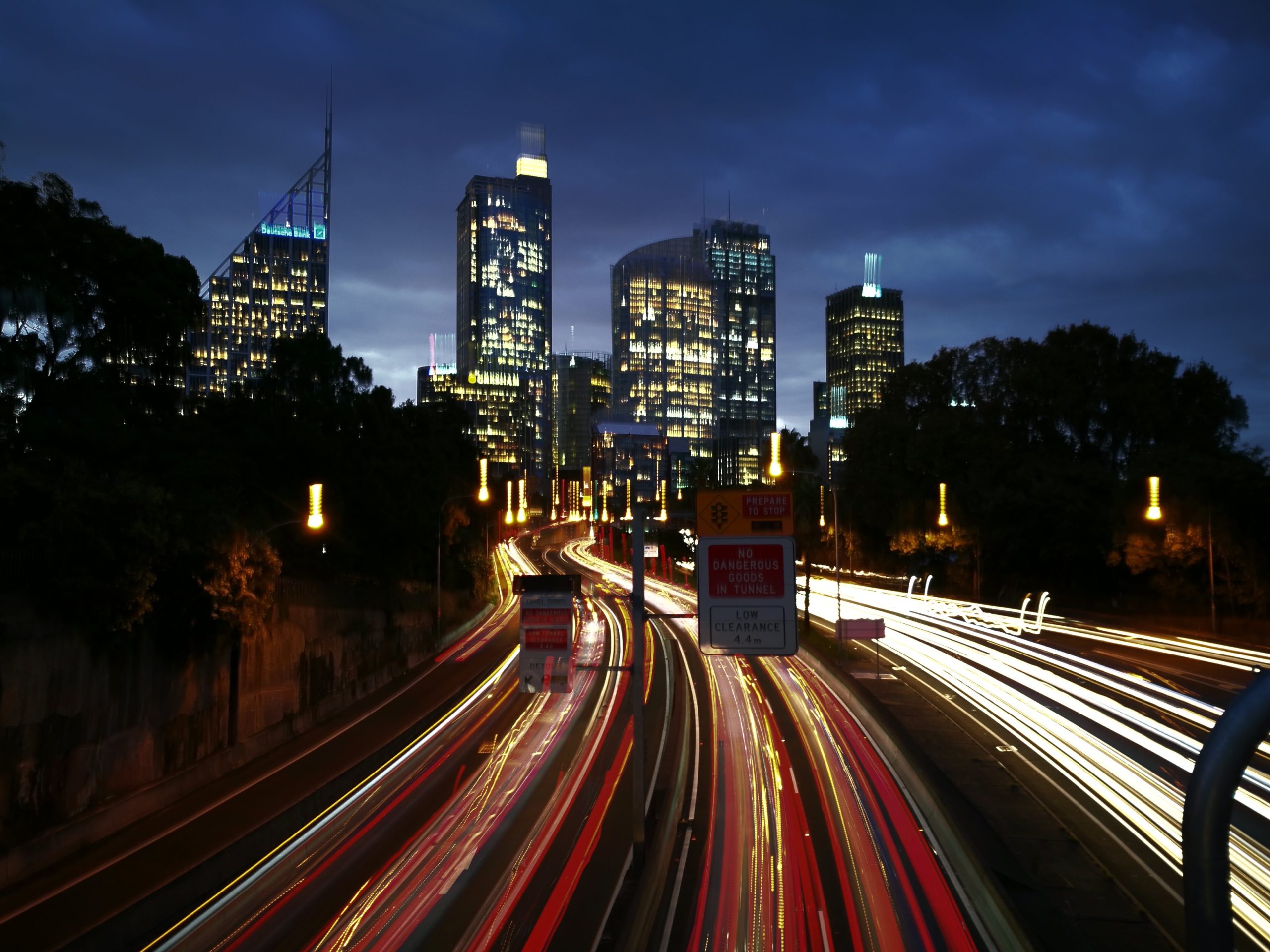 transport vehicals moving along highway at dusk timelapse